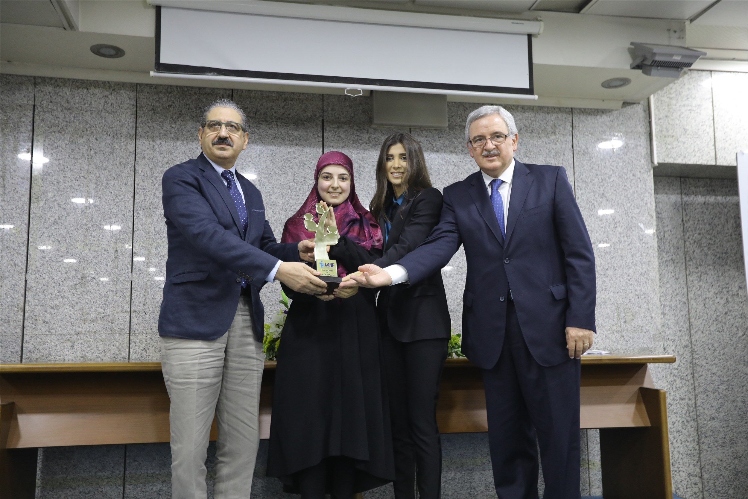 lu winner fatima mazeh receiving her award